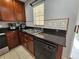 Modern kitchen with dark countertops and stainless steel appliances at 5434 River Rock Rd, Lakeland, FL 33809