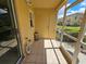 Screened-in porch with tile flooring and exterior storage at 5434 River Rock Rd, Lakeland, FL 33809