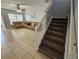 Stairs leading upstairs with carpeted steps and white railing at 5434 River Rock Rd, Lakeland, FL 33809