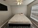 King-size bed in a well-lit bedroom with wood-look floors at 5434 River Rock Rd, Lakeland, FL 33809