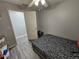 Small bedroom with twin bed and access to another room at 5434 River Rock Rd, Lakeland, FL 33809