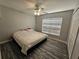 Spacious bedroom with large bed, ceiling fan, and window blinds at 5434 River Rock Rd, Lakeland, FL 33809
