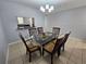 Dining room with a glass-top table and six chairs at 5434 River Rock Rd, Lakeland, FL 33809