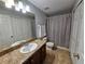 Bathroom with shower, toilet, and a vanity with a large mirror at 5434 River Rock Rd, Lakeland, FL 33809
