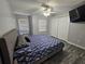 Spacious bedroom with king bed, ceiling fan, and walk-in closet at 5434 River Rock Rd, Lakeland, FL 33809