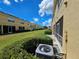 View of the backyards of townhouses and AC unit at 5434 River Rock Rd, Lakeland, FL 33809