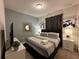Comfortable bedroom with king-size bed and stylish decor at 8940 Sydney Ave, Kissimmee, FL 34747