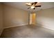 Spacious bedroom with ceiling fan and door to bathroom at 2119 Willow Brick Rd, Windermere, FL 34786