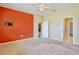 Bright bedroom with an accent wall and carpet flooring at 625 Via Corso Ct, Kissimmee, FL 34759