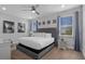Spacious bedroom with a king-size bed and large windows at 7481 Marker Ave, Kissimmee, FL 34747