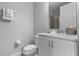 Clean bathroom with white cabinets, marble countertop, and a shower at 7481 Marker Ave, Kissimmee, FL 34747