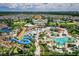 Aerial view of community with pools, waterpark, and homes at 7481 Marker Ave, Kissimmee, FL 34747