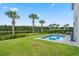 Enjoy this private backyard with a refreshing pool and lush landscaping at 7481 Marker Ave, Kissimmee, FL 34747
