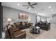Living room with gray sofas and a wood-paneled accent wall at 7481 Marker Ave, Kissimmee, FL 34747