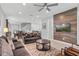 Living room with gray sofas and a wood-paneled accent wall at 7481 Marker Ave, Kissimmee, FL 34747