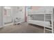 Bedroom with bunk beds and adjacent bathroom at 7481 Marker Ave, Kissimmee, FL 34747