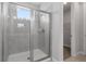Bathroom with a shower and walk-in closet at 7481 Marker Ave, Kissimmee, FL 34747