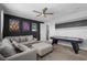 Game room features a sectional sofa and air hockey at 7481 Marker Ave, Kissimmee, FL 34747