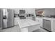 Modern kitchen features a large island and stainless steel appliances at 7481 Marker Ave, Kissimmee, FL 34747