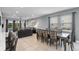 Dining room with glass-top table and seating for eight at 7481 Marker Ave, Kissimmee, FL 34747