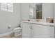 Clean bathroom with white vanity and marble countertop at 7481 Marker Ave, Kissimmee, FL 34747