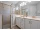 Double vanity bathroom with a large walk-in shower at 7481 Marker Ave, Kissimmee, FL 34747
