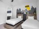 Two twin beds in a bedroom with a Batman mural at 7481 Marker Ave, Kissimmee, FL 34747