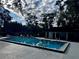 Inviting community pool with surrounding lounge chairs at 180 Waterfall Way # 203, Altamonte Springs, FL 32714