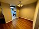 Simple dining room with wood-look flooring and kitchen access at 180 Waterfall Way # 203, Altamonte Springs, FL 32714