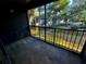Private screened balcony overlooking a wooded area at 180 Waterfall Way # 203, Altamonte Springs, FL 32714