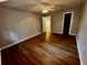 Simple bedroom with wood-look flooring and ceiling fan at 180 Waterfall Way # 203, Altamonte Springs, FL 32714