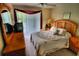 Large bedroom featuring wooden furniture and access to a private balcony at 8516 Crystal Cove Loop, Kissimmee, FL 34747