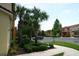 Townhome nestled among palm trees with convenient parking and sidewalk at 8516 Crystal Cove Loop, Kissimmee, FL 34747