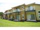 Townhomes with balconies overlooking a grassy common area at 8516 Crystal Cove Loop, Kissimmee, FL 34747
