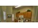 Practical kitchen featuring wood cabinetry and essential appliances at 8516 Crystal Cove Loop, Kissimmee, FL 34747
