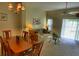 Welcoming living room with dining area and sliding glass doors at 8516 Crystal Cove Loop, Kissimmee, FL 34747