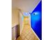 Bright hallway with blue accent wall and tiled flooring at 1304 Seven Eagles Ct # 1304, Reunion, FL 34747
