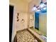 Bathroom with granite countertop and Minions wall decals at 1304 Seven Eagles Ct # 1304, Reunion, FL 34747