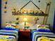 Minions-themed bedroom with two twin beds and a fun mural at 1304 Seven Eagles Ct # 1304, Reunion, FL 34747