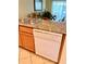 Kitchen boasts granite countertops and a built-in dishwasher at 1304 Seven Eagles Ct # 1304, Reunion, FL 34747