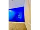 Welcoming hallway with blue walls and Mickey Mouse wall art at 1304 Seven Eagles Ct # 1304, Reunion, FL 34747