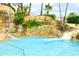 Resort-style pool with a waterfall feature at 1304 Seven Eagles Ct # 1304, Reunion, FL 34747