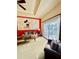 Living room features Mickey Mouse mural and comfy seating at 1304 Seven Eagles Ct # 1304, Reunion, FL 34747