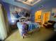 Spacious bedroom with Frozen-themed decor and ensuite bath at 1304 Seven Eagles Ct # 1304, Reunion, FL 34747
