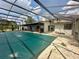 Screened pool and patio area with lake view at 368 Fairgreen Pl, Casselberry, FL 32707