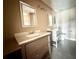 Updated bathroom with double vanity and tile floor at 368 Fairgreen Pl, Casselberry, FL 32707