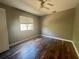Bright bedroom with hardwood floors and ceiling fan at 368 Fairgreen Pl, Casselberry, FL 32707