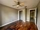 Well-lit bedroom with wood flooring and a walk-in closet at 368 Fairgreen Pl, Casselberry, FL 32707