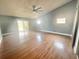 Large living room with hardwood floors and high ceilings at 368 Fairgreen Pl, Casselberry, FL 32707
