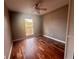 Large bedroom with wood floors and a ceiling fan at 368 Fairgreen Pl, Casselberry, FL 32707